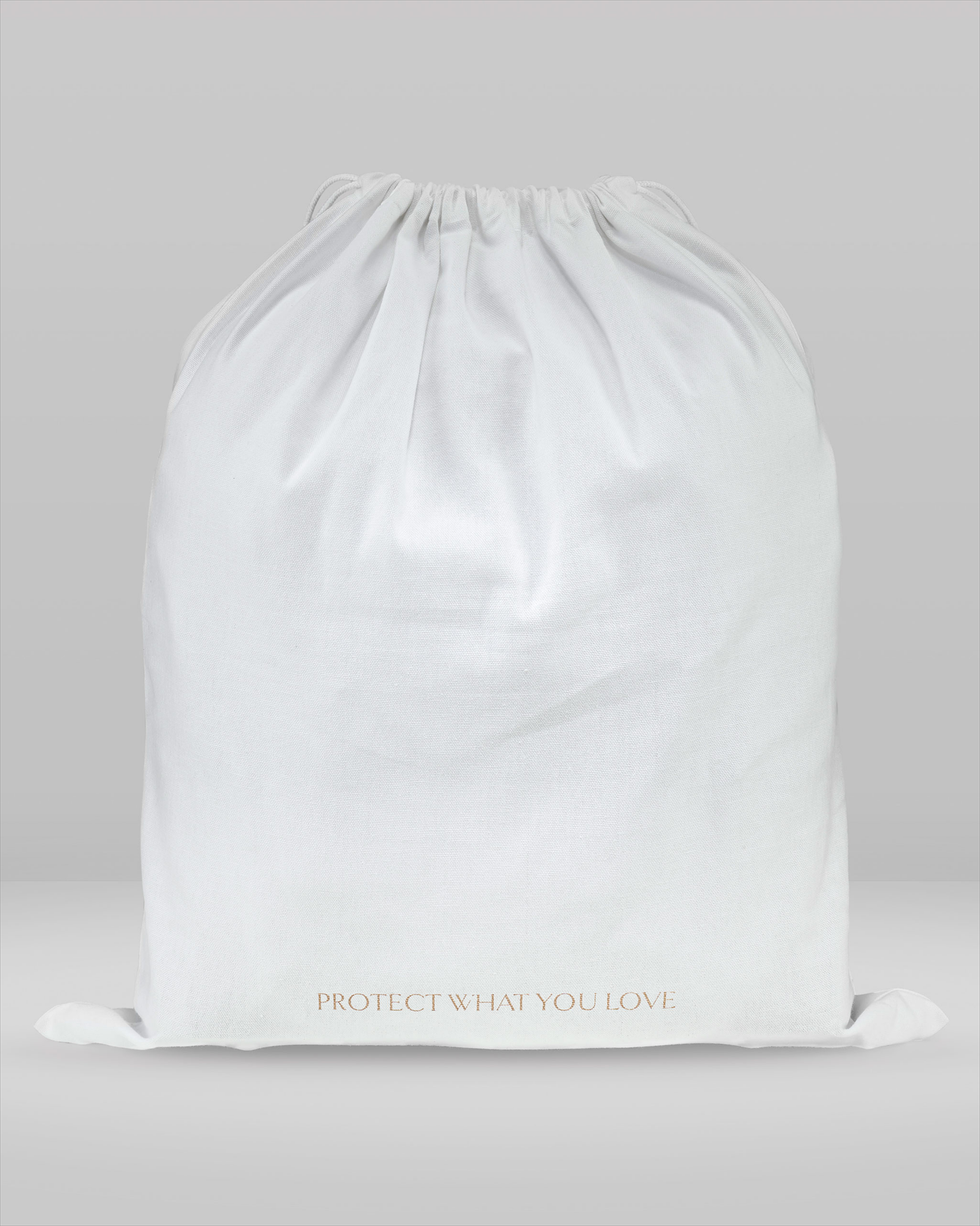 White drawstring bag with 'Protect What You Love' text on a light gray background