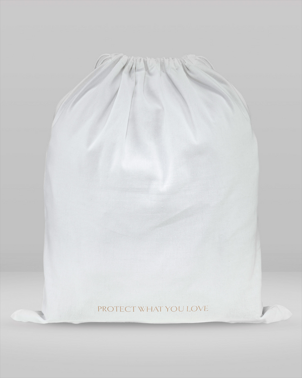 White drawstring bag with 'Protect What You Love' text on a light gray background