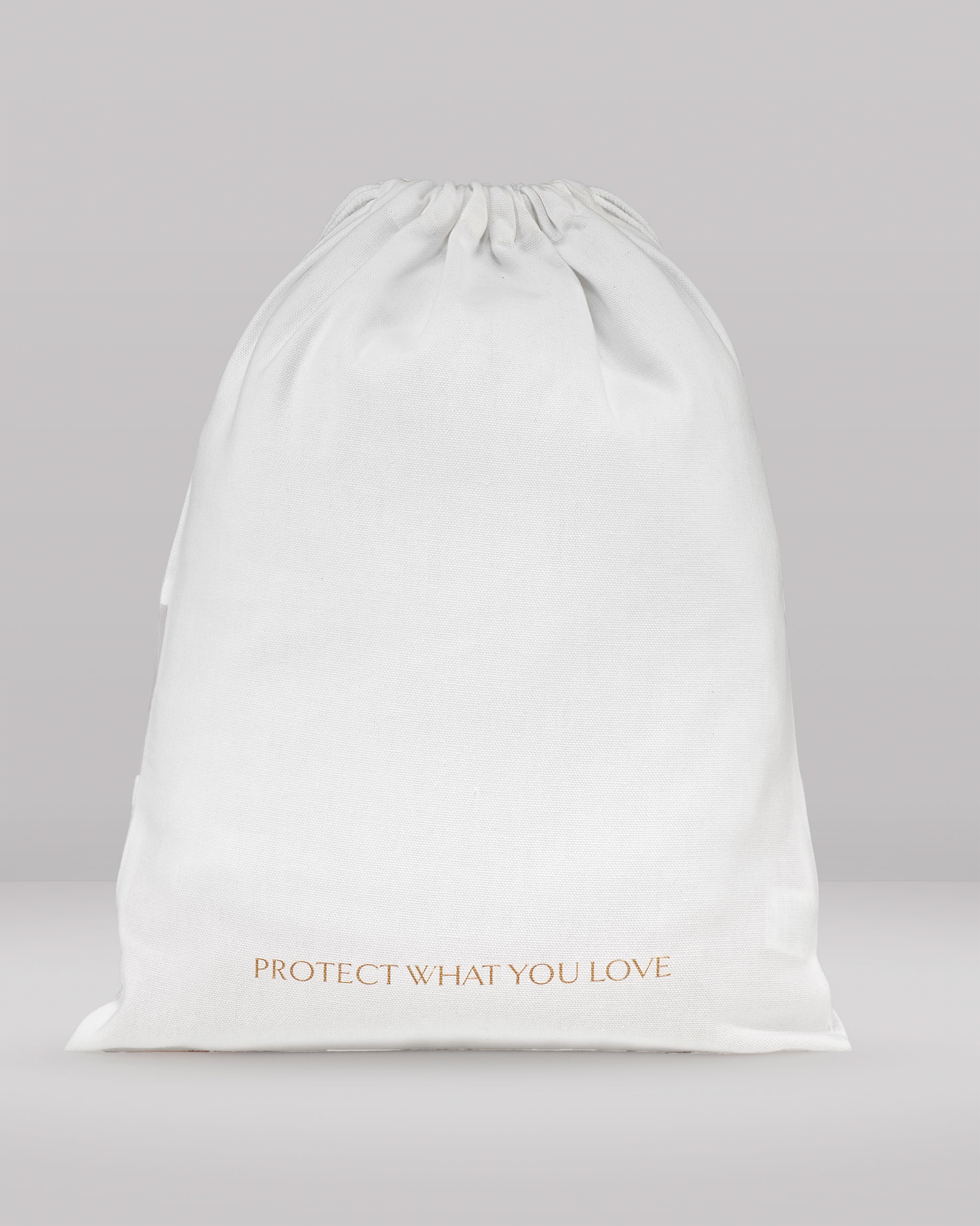White drawstring bag with 'PROTECT WHAT YOU LOVE' text on a gray background