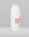 White clutch bag with sheer overlay on a gray background