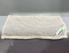 Mesh bag with a brand label on a gray surface