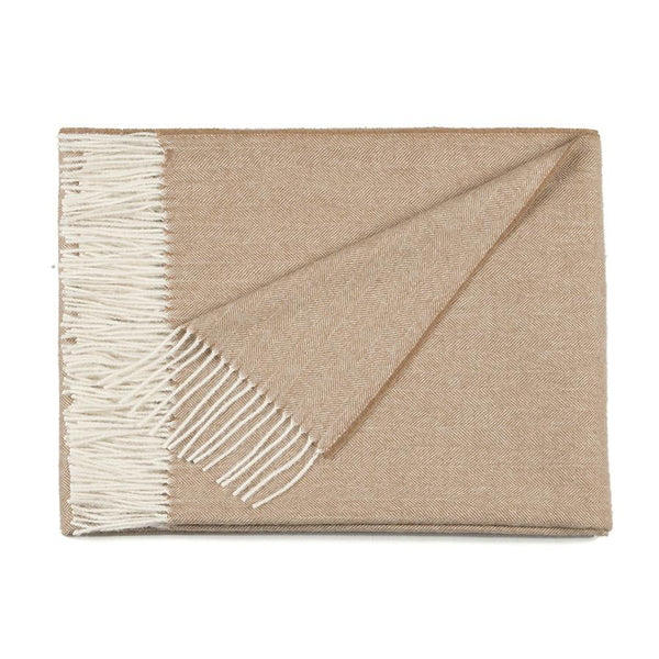 Herringbone alpaca throw blanket in use as a stylish and sustainable gift or everyday comfort layer