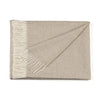 Beige throw blanket with white fringe on a white background