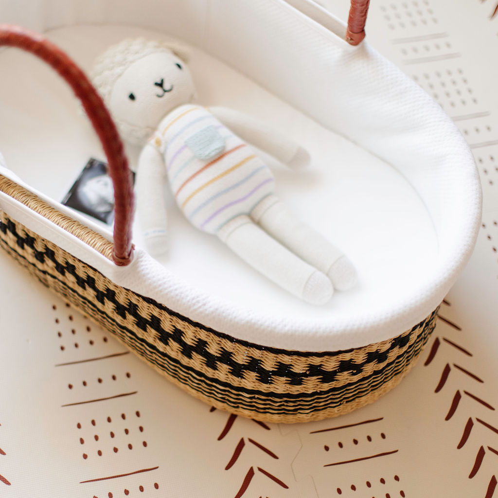 Plum + Sparrow Moses basket with hooded cotton liner fitted inside
