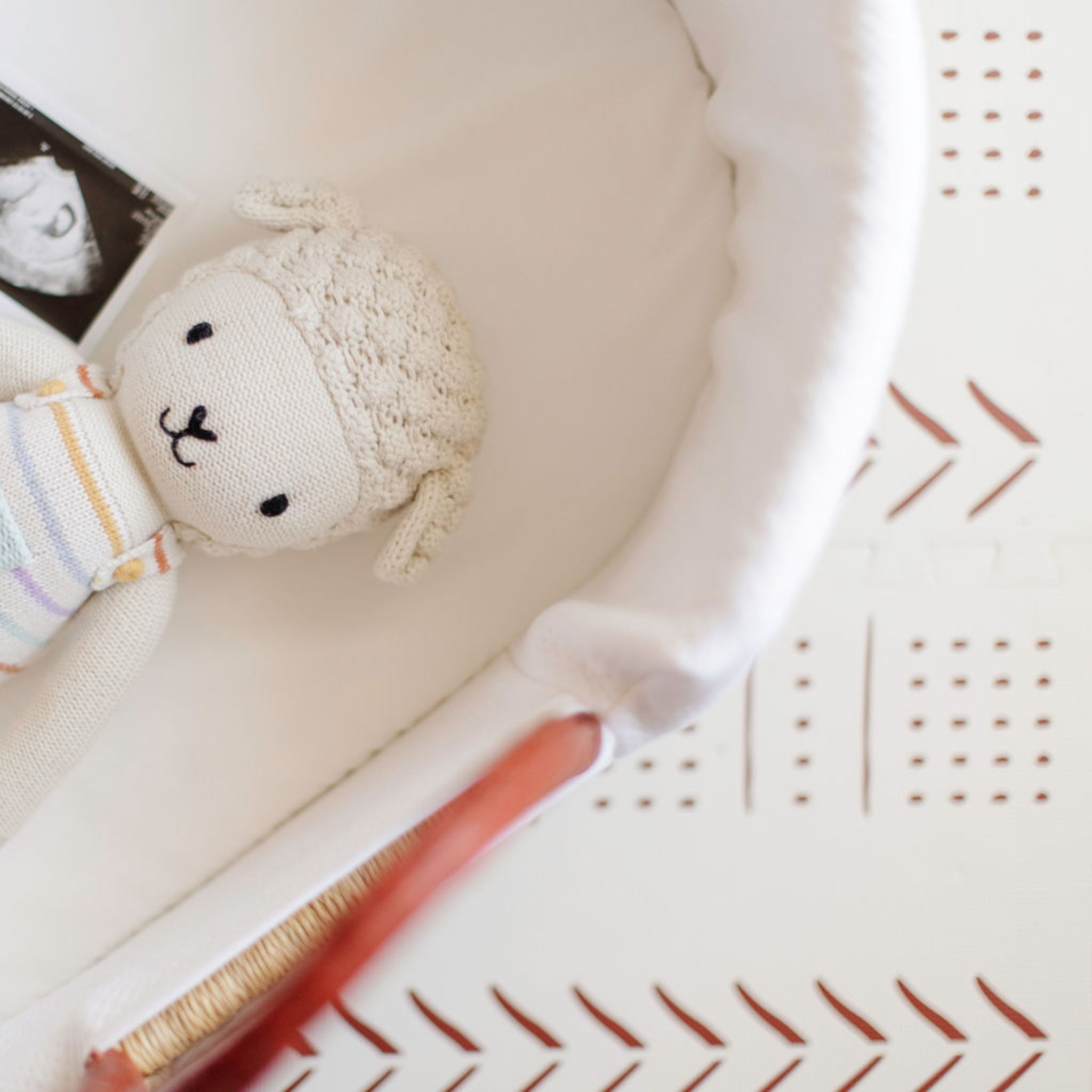Baby rattle and toy with a patterned basket