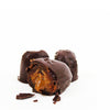 Close-up of a chocolate-covered treat on a white background