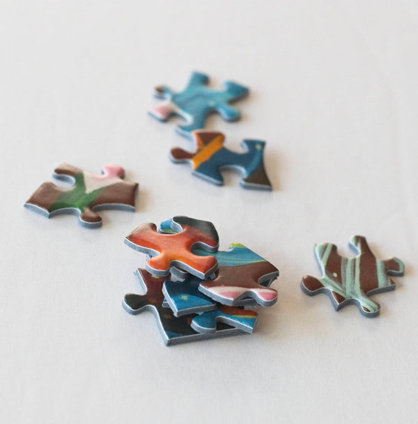 Loose Hummingbird Spirit puzzle pieces from the 500-piece Paul Lewin jigsaw