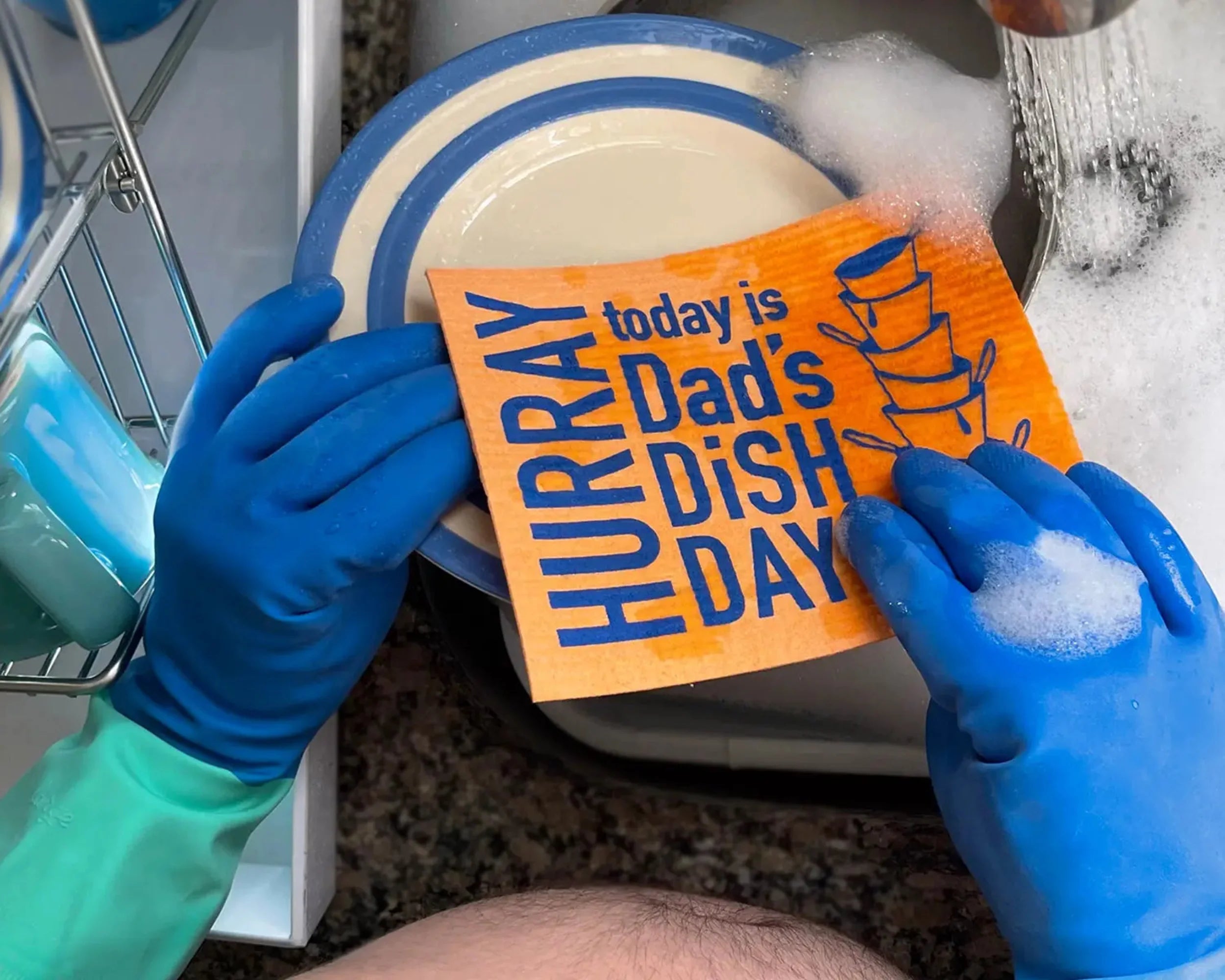 Close-up of Dad's Dish Day Swedish dishcloth by Soak iT Up showing cellulose-cotton fabric texture and colourful printed Father's Day message