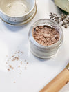 Butter Me Up Organics organic finishing powder displayed on a flat lay surface — plastic-free, cruelty-free makeup