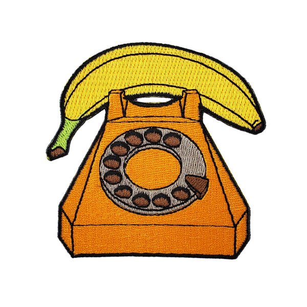 Calling all comedy fans and banana enthusiasts! Answer the call of fun with the hilarious Banana Phone Patch. This 3-inch embroidered patch features a classic phone prop, perfect for ironing or sewing onto jackets, bags, backpacks, and more. Available in iron-on, sew-on, and easy-to-use hook and loop versions. It's the perfect conversation starter and unique gift for anyone who appreciates a good chuckle. Order yours today and get ready to peel into laughter!