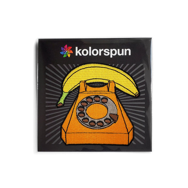 Calling all comedy fans and banana enthusiasts! Answer the call of fun with the hilarious Banana Phone Patch. This 3-inch embroidered patch features a classic phone prop, perfect for ironing or sewing onto jackets, bags, backpacks, and more. Available in iron-on, sew-on, and easy-to-use hook and loop versions. It's the perfect conversation starter and unique gift for anyone who appreciates a good chuckle. Order yours today and get ready to peel into laughter!