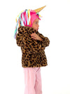 Child wearing a leopard print hoodie with a colorful unicorn hat on a white background