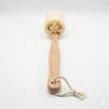 Wooden back scrubber with a natural loofah on a white background