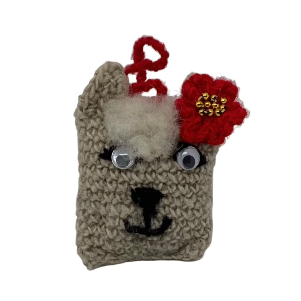 Collection of unique handmade llama ornaments crafted from organic wool, each with a one-of-a-kind face