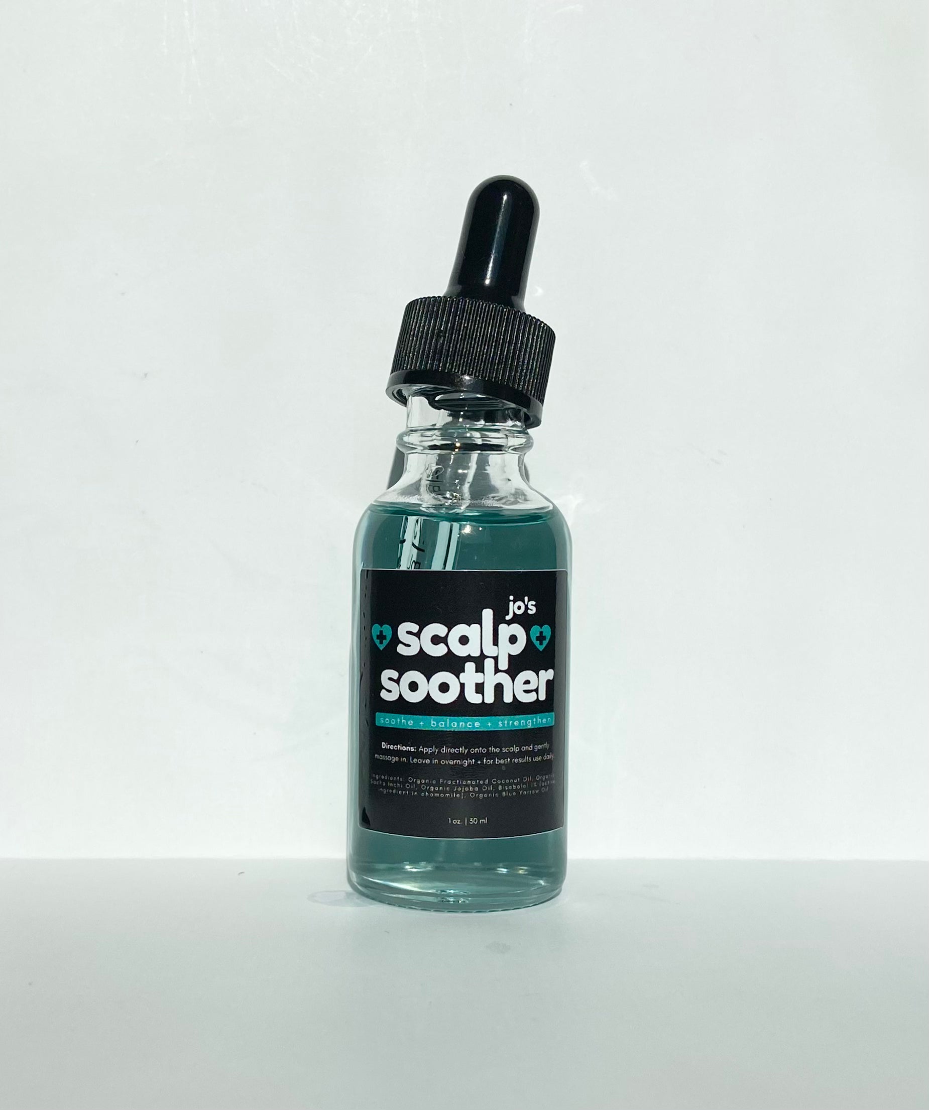 Bottle of 'jo's Scalp Soother' on a white background. Soothe dandruff, psoriasis, and itchy scalp with Jo’s Scalp Soother Serum. Featuring 1% Bisabolol and Blue Yarrow, this organic treatment calms inflammation and strengthens hair. Shop sustainable, eco-friendly beauty at Clozist!