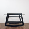 Plum+Sparrow black rocking Moses basket stand displayed with Moses basket in a nursery setting