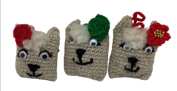 Handcrafted organic wool llama face ornament made by women artisans of the Refugio Rafael community