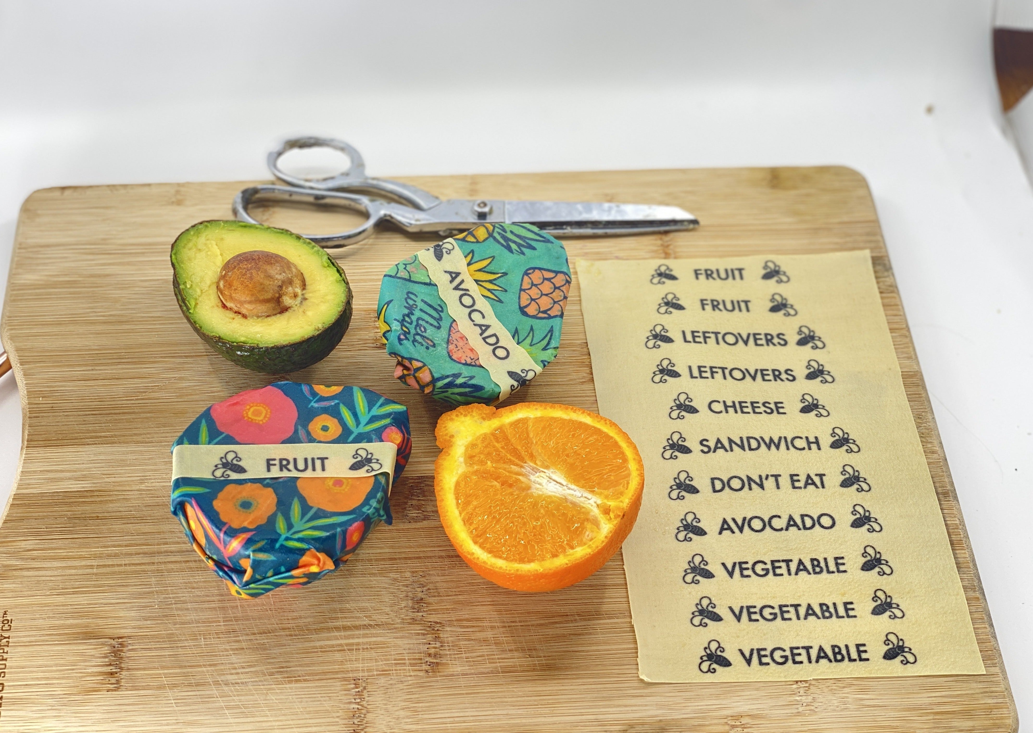 Meli Wraps Beeswax Wrap labeled with a Buzz Words sticker in the refrigerator