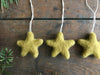 Add a touch of celestial charm to your holiday decor with this handmade, eco-friendly wool star ornament. Perfect for Christmas trees, wreaths, or as a gift.