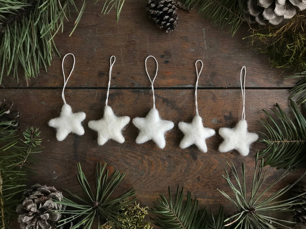 Set of five Snowberry White needle-felted wool star ornaments