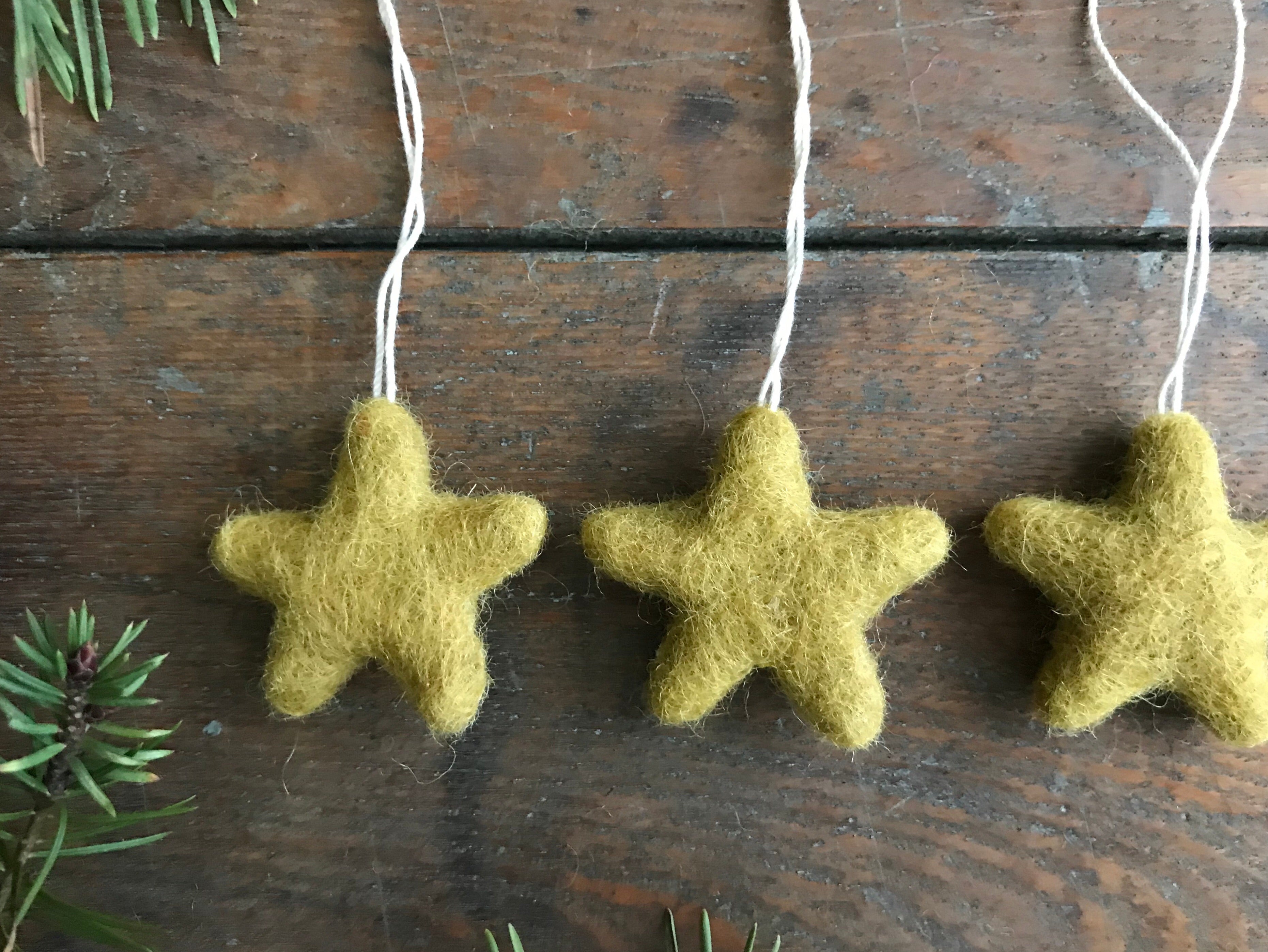 Wool star ornaments in gold clay yellow from the House of Moss set of 5