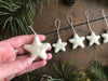 Snowberry White wool star ornament with cotton string loop