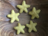 Felted wool stars in Gold Clay Yellow from House of Moss, set of 5