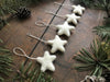 Close view of a Snowberry White wool star ornament