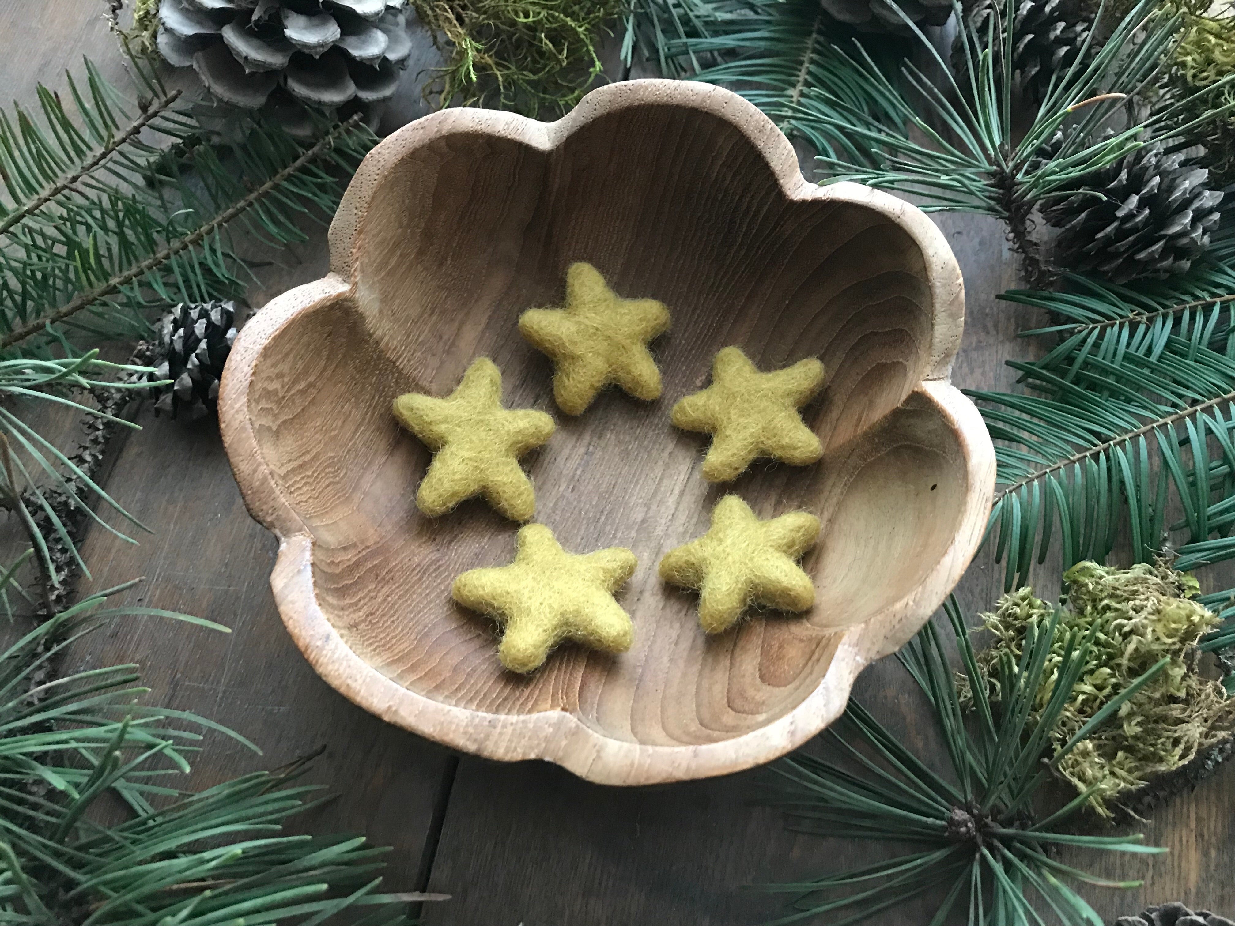 Gold Clay Yellow felted wool stars arranged together as tabletop decorations