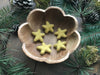 Gold Clay Yellow felted wool stars arranged together as tabletop decorations
