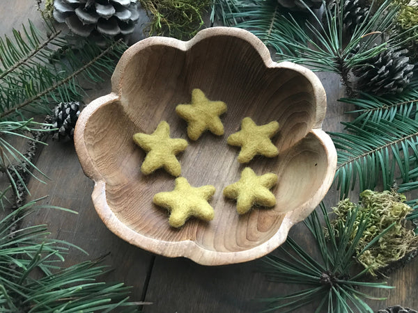 Gold Clay Yellow felted wool stars arranged together as tabletop decorations