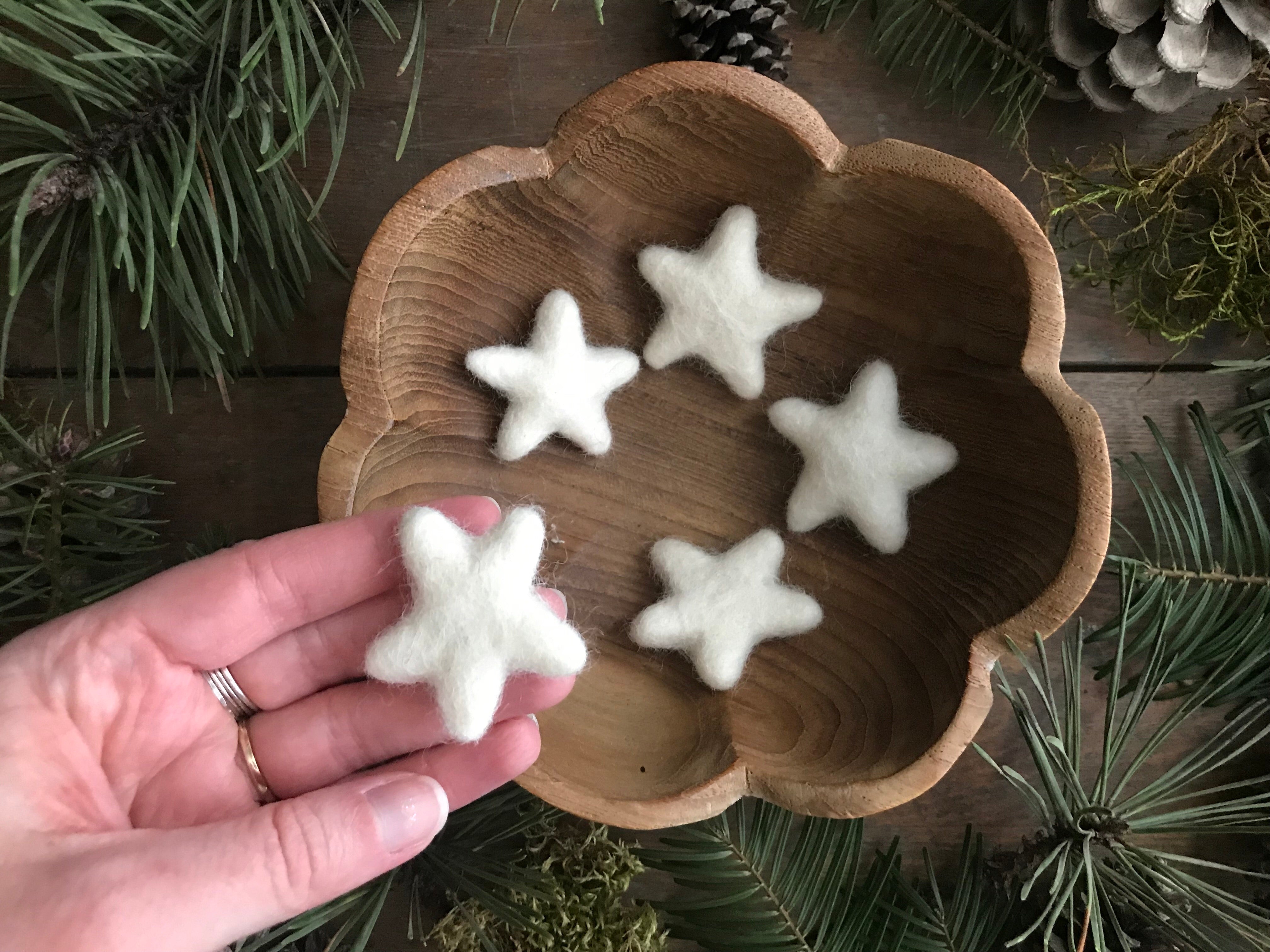 Felted wool stars in Snowberry White, needle-felted and slightly varied in shape