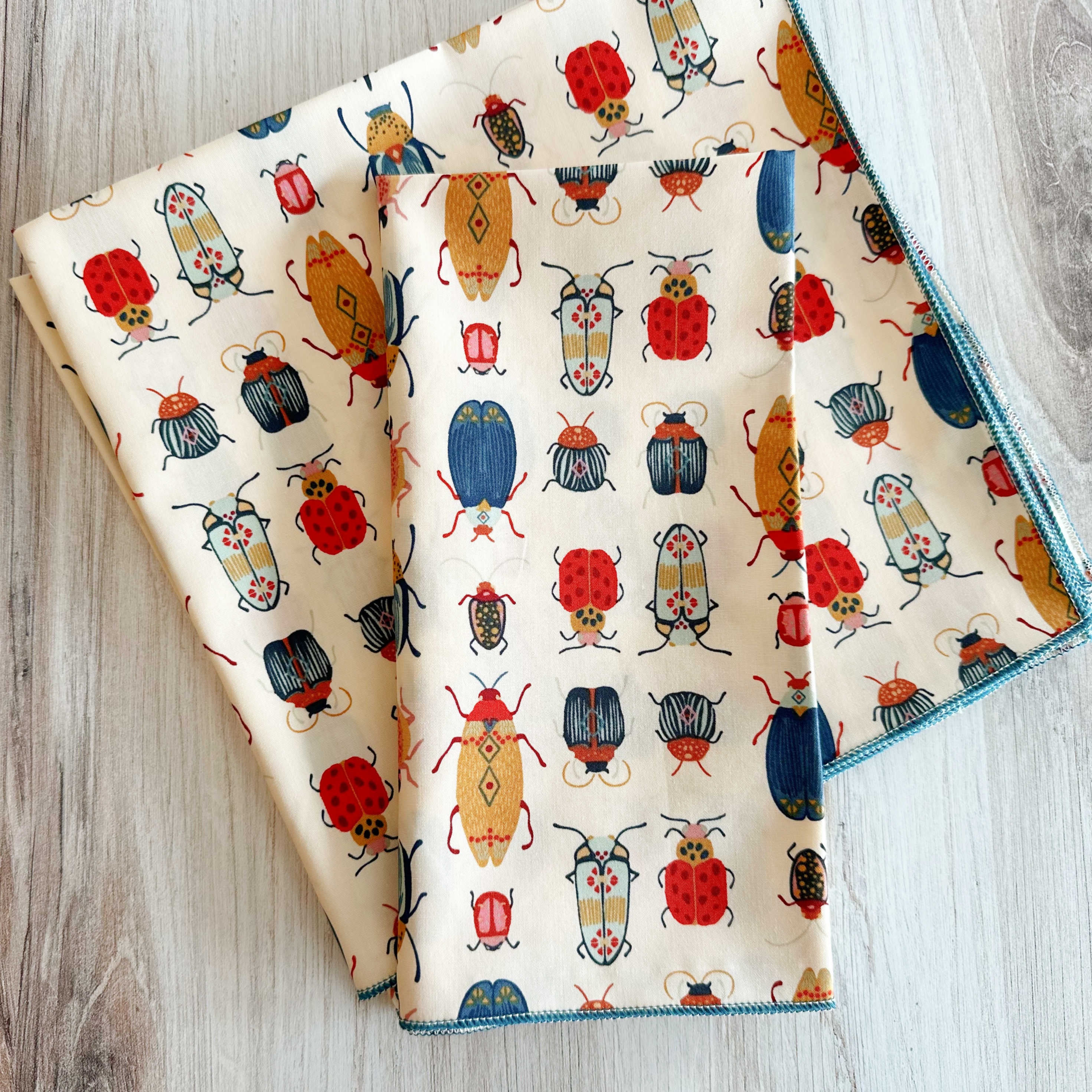 Beetle print everyday cloth napkins laid flat, 18-inch size, set of four