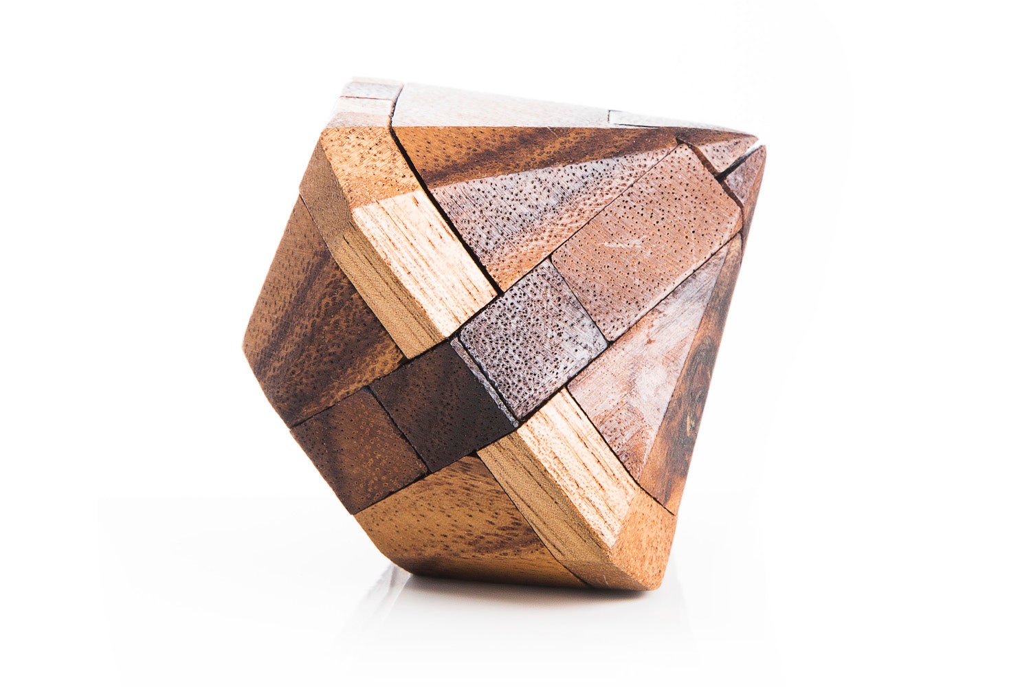 Interlocking Japanese Diamond wooden puzzle fully assembled on a flat surface