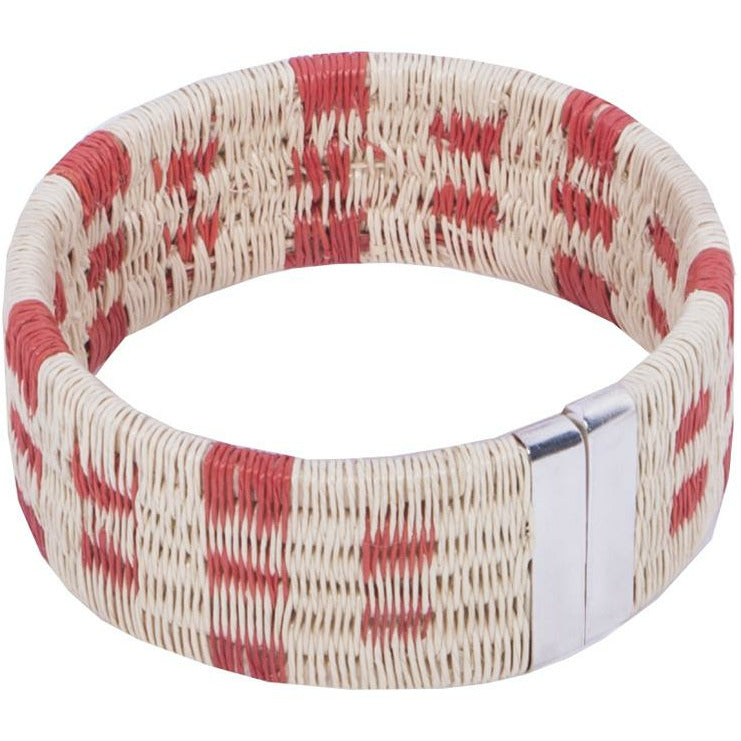 Tulia Island Palm Woven Cuff in coral featuring palm thread and copper wire weave