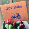 Joy Rider bike-themed Swedish dishcloth laid flat showing full cycling print design