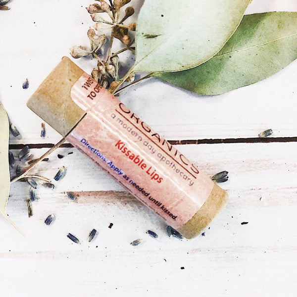 Close-up of Kissable Lips organic lip balm paperboard tube – plastic-free and cruelty-free