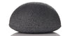 Dry konjac facial sponge infused with Binchotan charcoal, ready to soak in water