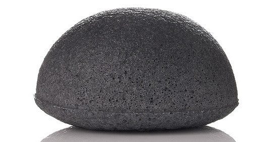 Dry konjac facial sponge infused with Binchotan charcoal, ready to soak in water