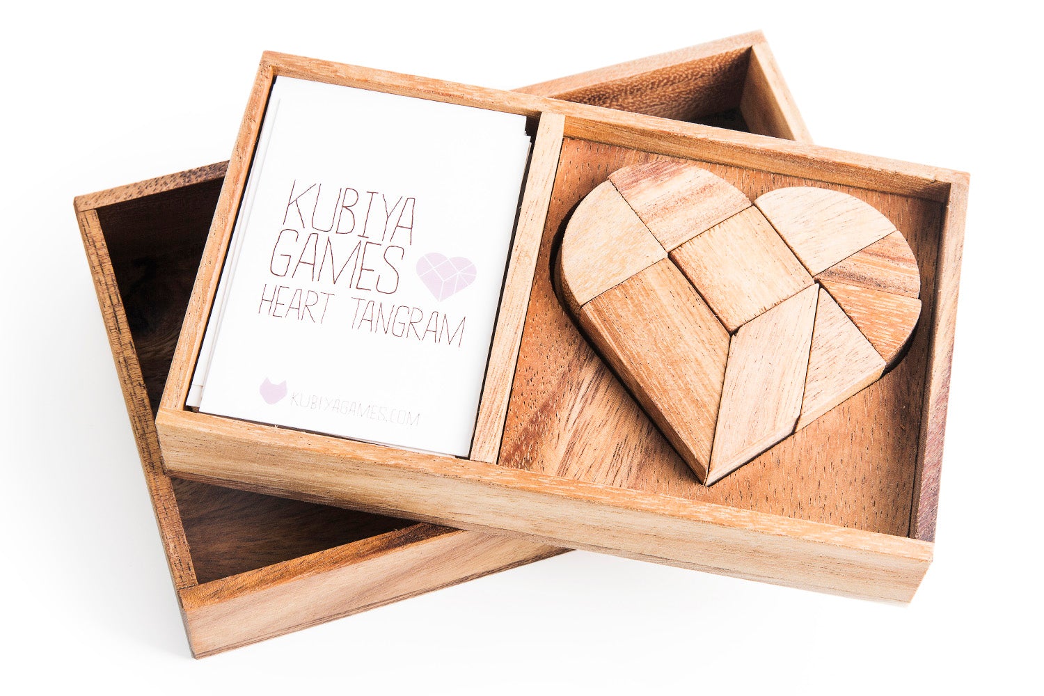 Wooden heart-shaped tangram puzzle in a box with 'Kubva Games' branding.
