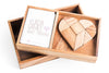 Wooden heart-shaped tangram puzzle in a box with 'Kubva Games' branding.