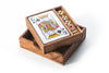 Wooden box containing playing cards and dominoes on a white background