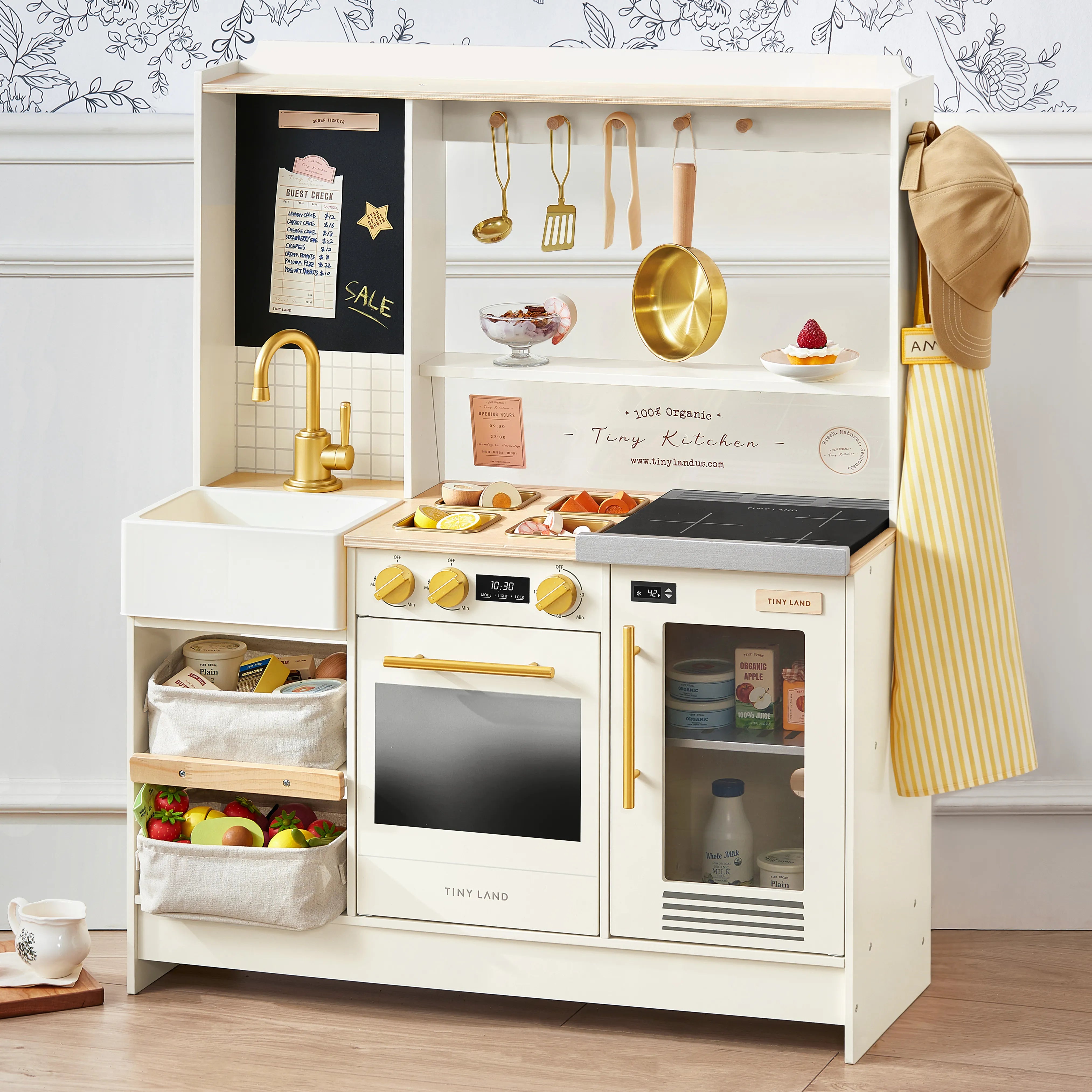 Children's play kitchen set with various accessories on a neutral background