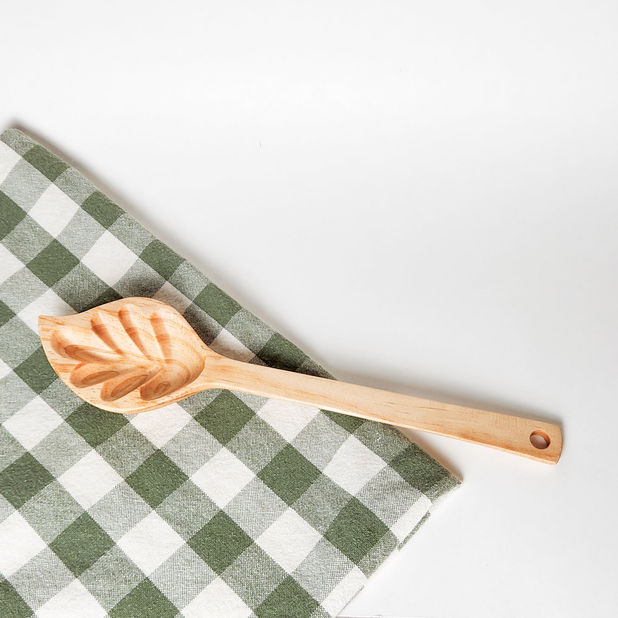 Enhance your dining experience with our handcrafted Wood Leaf Spoon. Made from reclaimed wood, this stylish and functional spoon is perfect for serving soups, stews, and sauces.