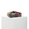 Lilac silk furoshiki wrap tied around a gift, displaying summer floral pattern in lilac and complementary tones