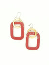 Close-up of Fair Anita linked horn earrings showing lacquered finish and connected pendant design