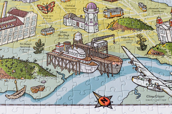 Detail of the Long Lost Oakland puzzle showing the drydock and shellmound illustrations