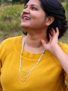 Long layered braided metal necklace by Fair Anita styled on model