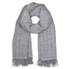 Gray alpaca scarf with fringes on a white background