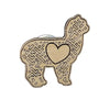 Wooden pin with llama shape and heart detail on a wooden surface